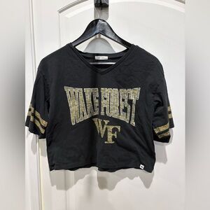 47 Wake Forest Black Cropped V-Neck Tee with Gold Logo
